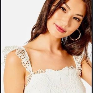 Lilly Pulitzer White Butterfly Tank size L sold out at LIlly stores.